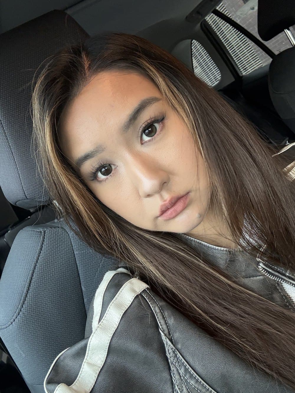 Helen in a car selfie wearing soft everyday makeup